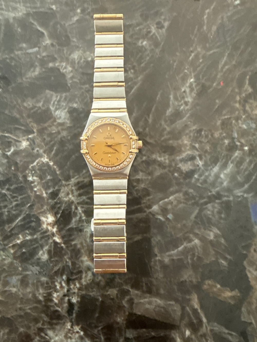 Ladies Omega stainless and 18kt gold diamond bezel watch